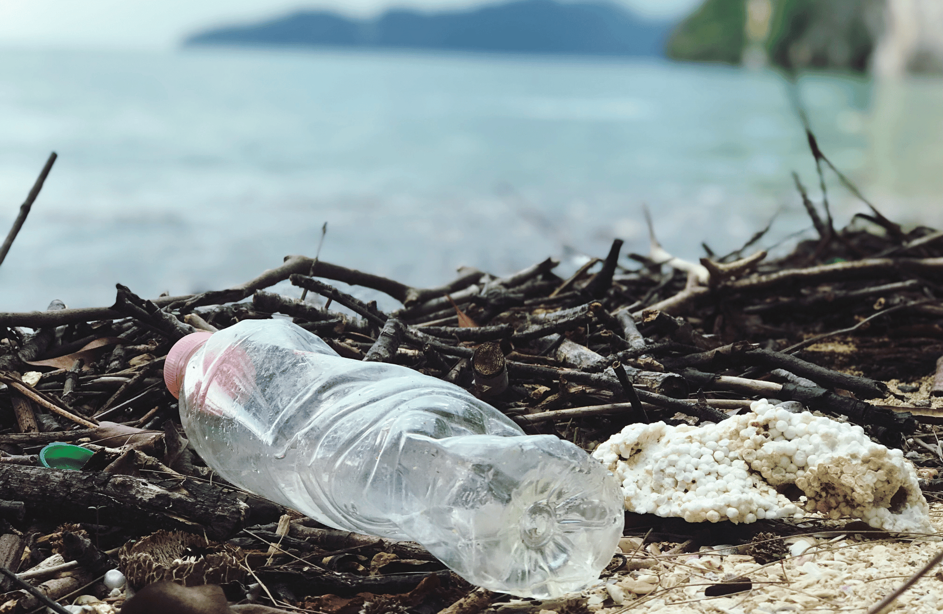 plastic bottle lies abandoned on the sand